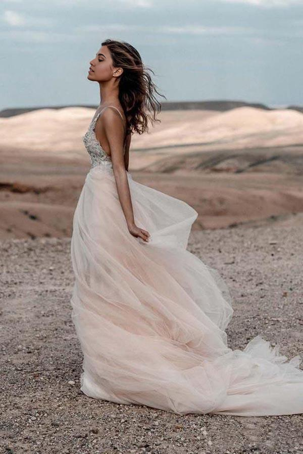 Side profile of the A-line wedding dress, highlighting the flowing skirt and silhouette.