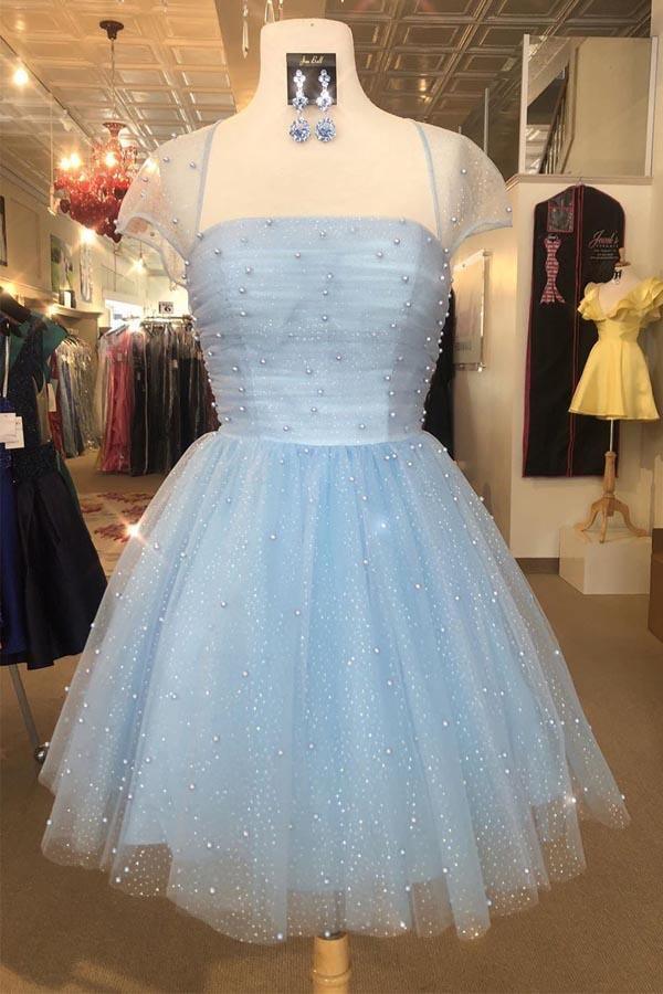 Front view of a sparkling light blue homecoming dress with beaded cap sleeves.