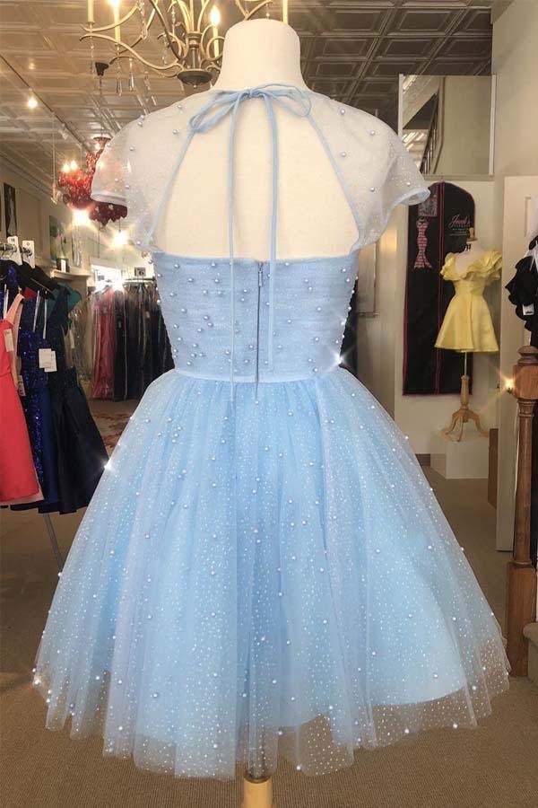 Close-up of the beaded cap sleeves on a light blue formal dress.
