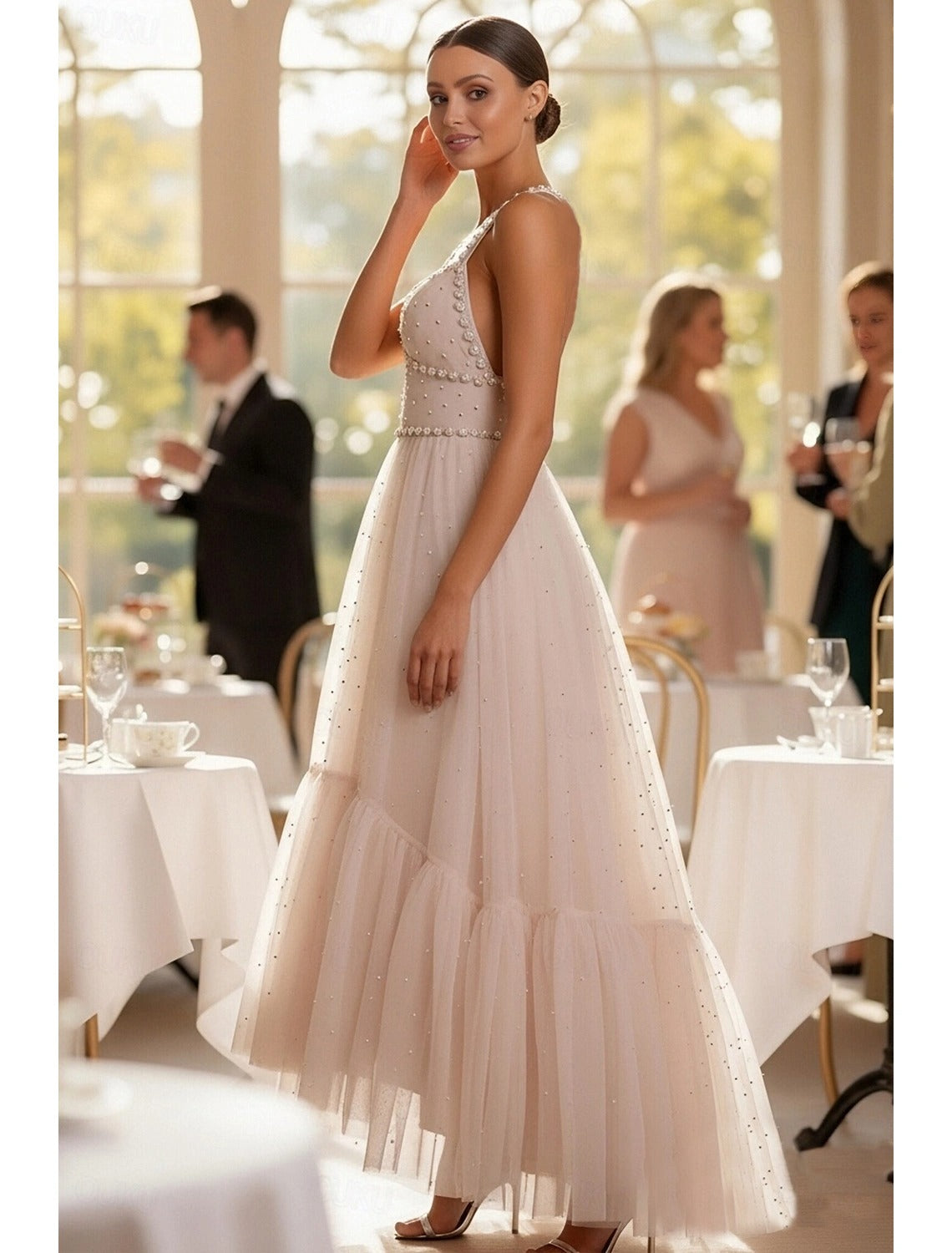 Floor length formal dress featuring a sparkling beaded halter neckline.