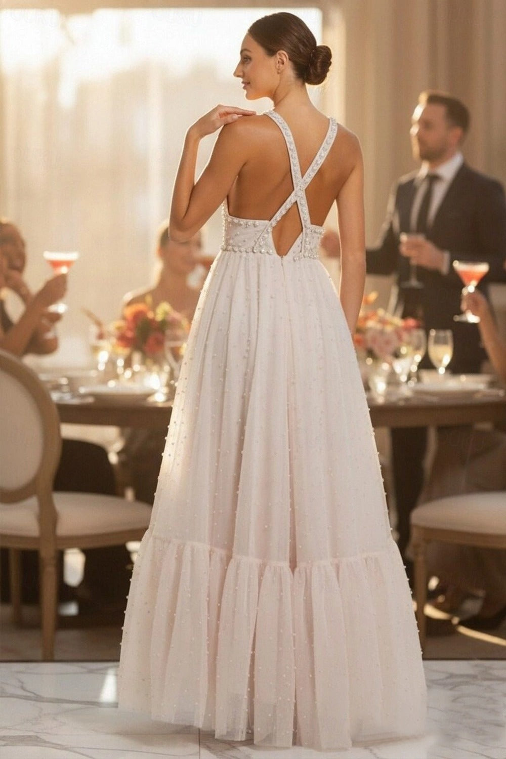 Back view of the tiered tulle formal dress with crisscross straps.