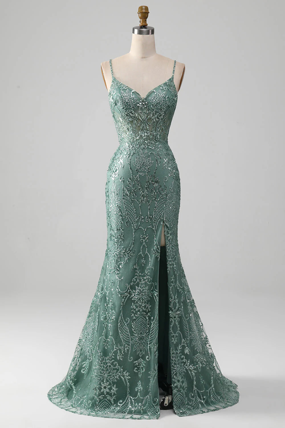 Woman wearing a sparkling beaded ankle-length prom dress.