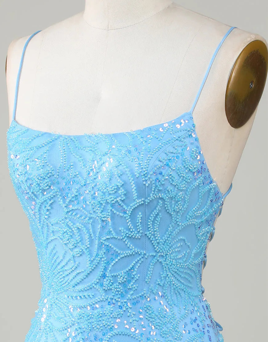 Model posing in a blue beaded short homecoming dress, side view.