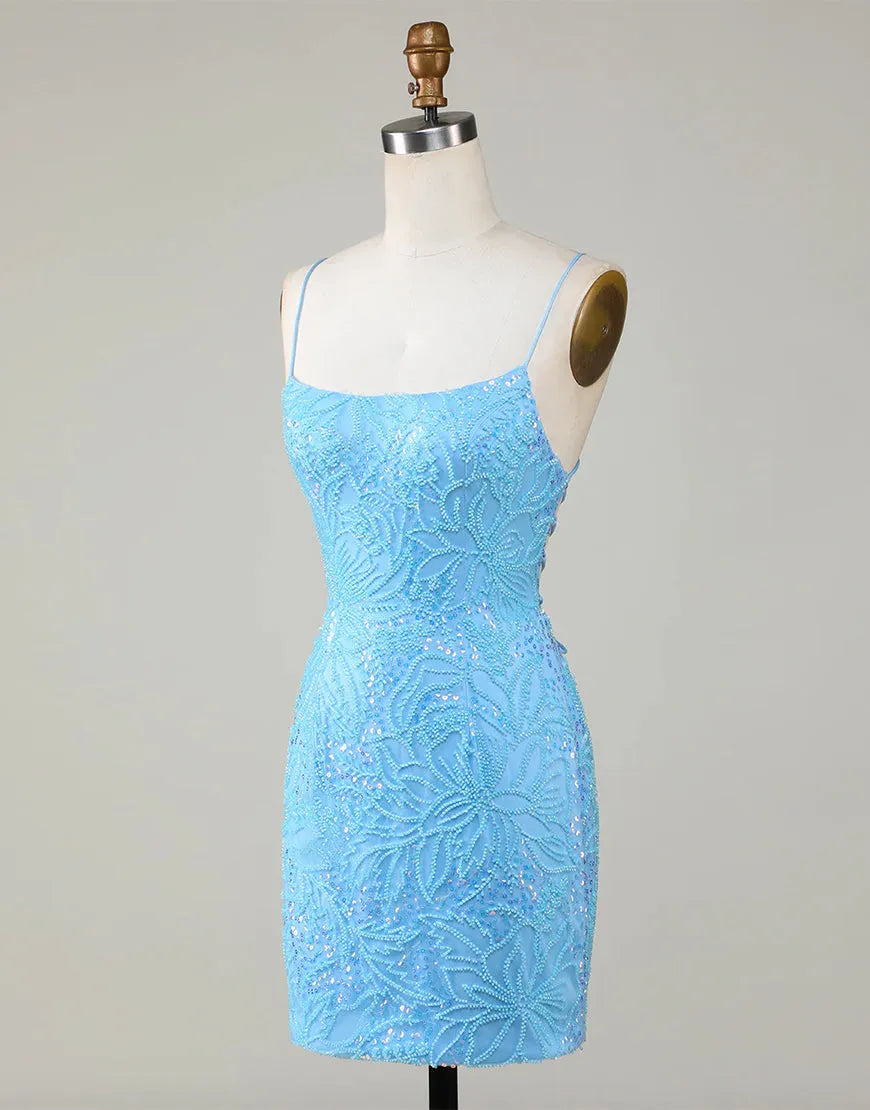 Model in a blue beaded short homecoming dress, another angle.