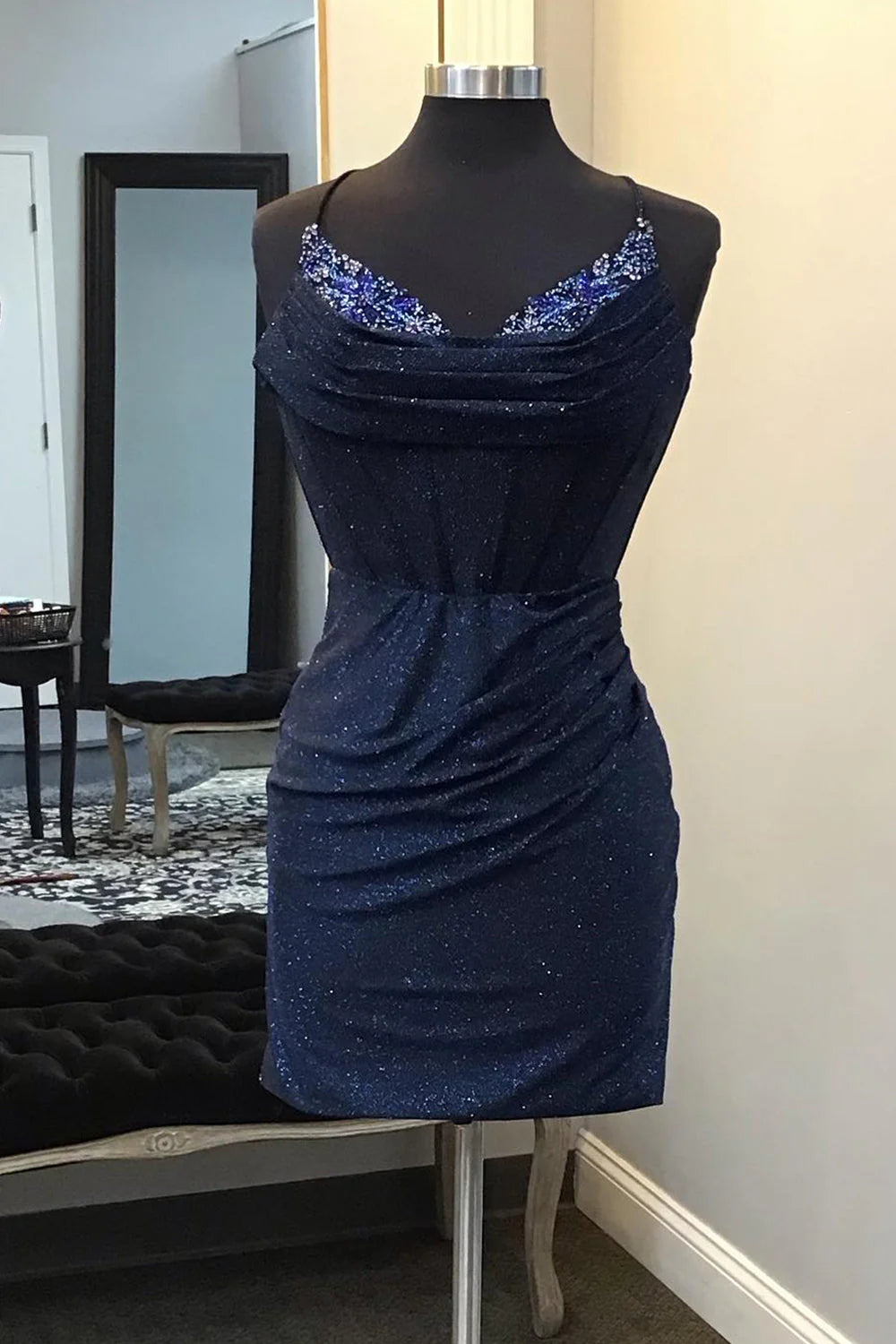 Full length view of the elegant short beaded party dress.
