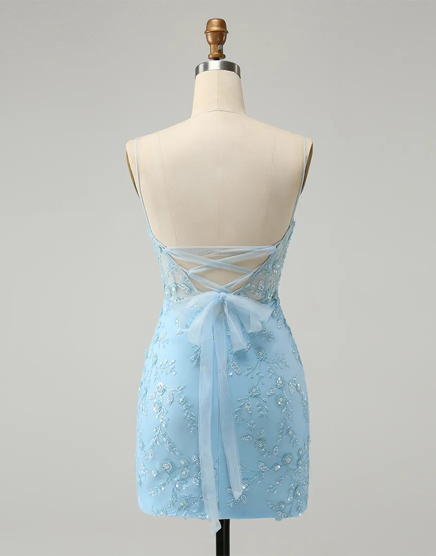 Side view of a woman wearing a blue glitter sheath dress with delicate beaded details.