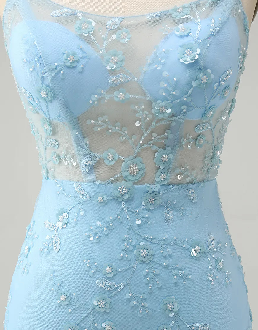 Close-up of the beaded flower embellishments on a blue spaghetti strap dress.