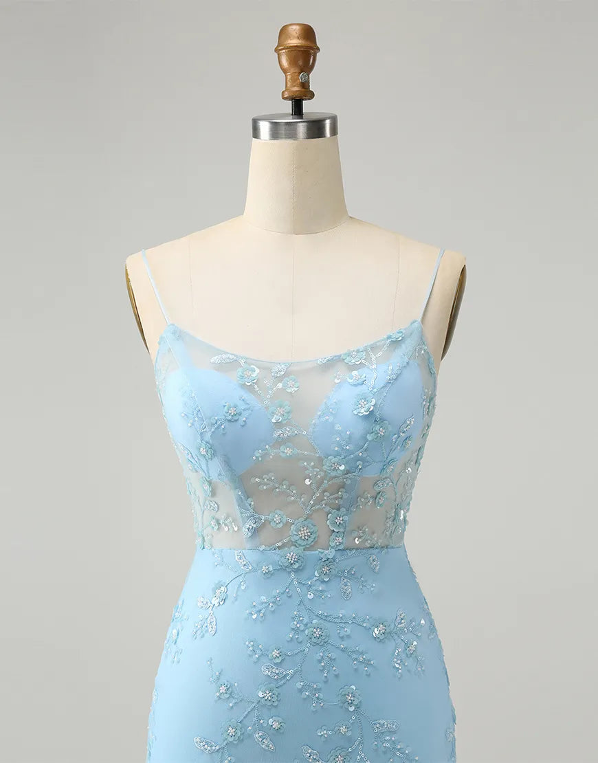 Full length view of a woman posing in a blue formal dress with glitter and spaghetti straps.