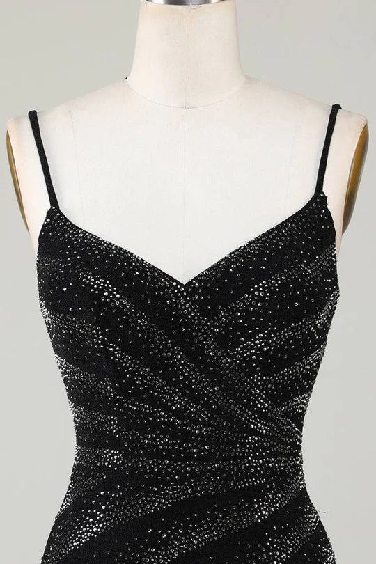 Detail of the spaghetti straps and V-neckline of a party dress.