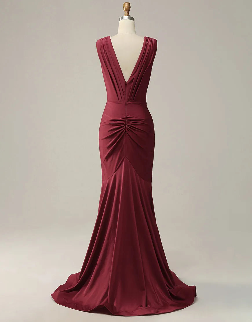 Back view of a sparkling burgundy mermaid gown with pleating.