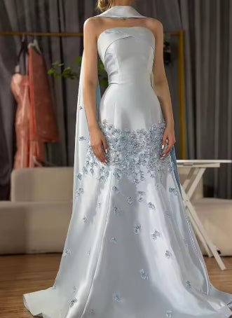 Elegant strapless A-line evening dress with crystal pearl embellishments.