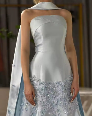 Front view of the A-line prom dress showcasing crystal pearl details.