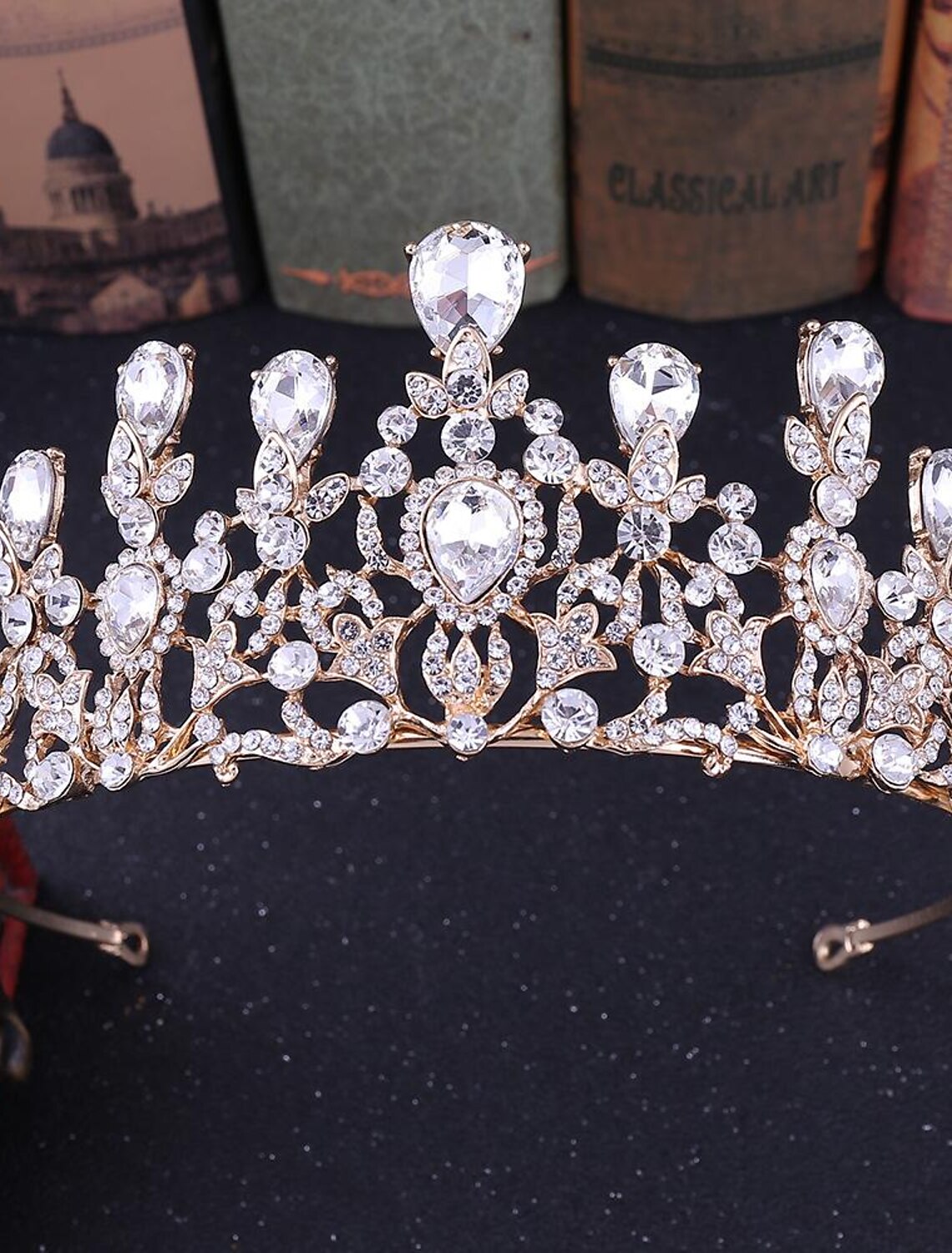 Front view of a woman wearing a dazzling rhinestone tiara.