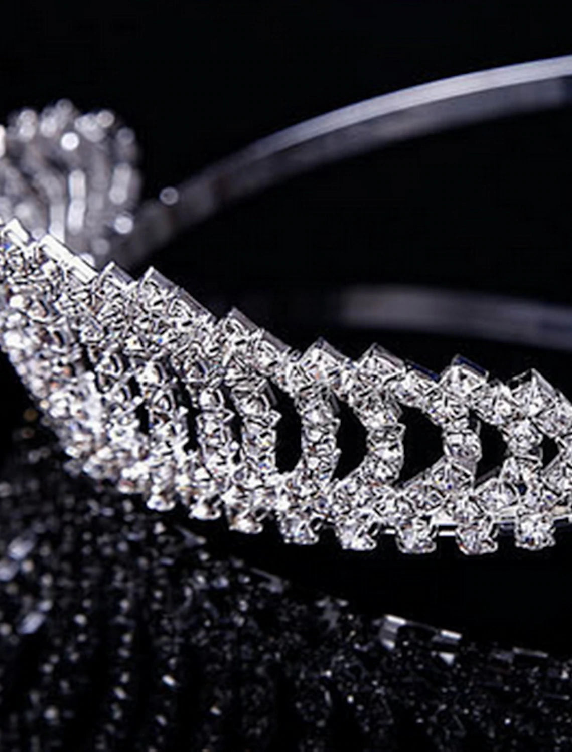 Sparkling crystal tiara with intricate design.