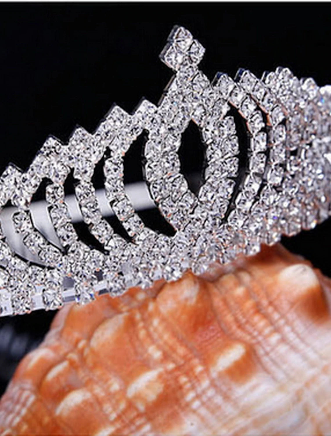 Crystal tiara with various sized rhinestones.