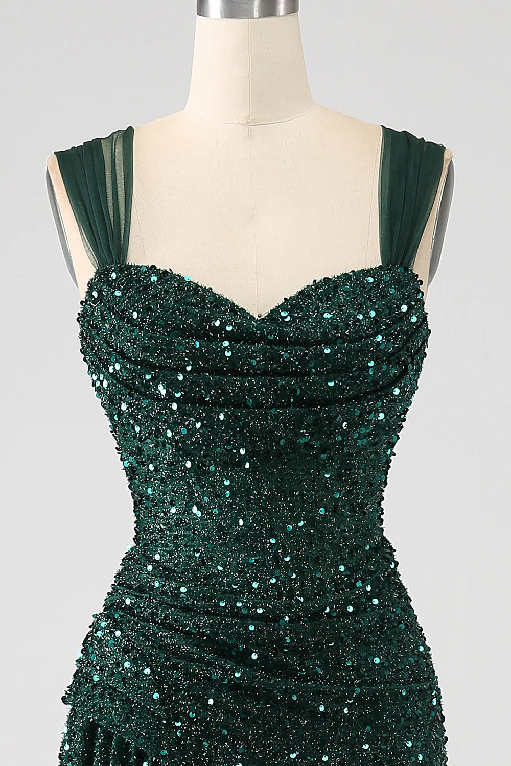 Back view of the dark green sequin sheath prom dress, showcasing its long silhouette.