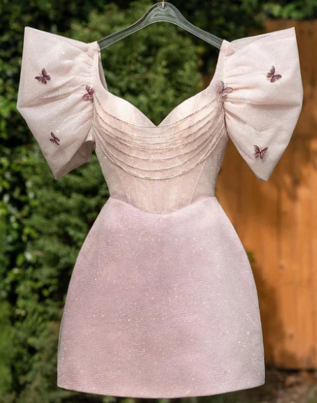 Sparkling glitter A-line V-neck short homecoming dress with puff sleeves and beading.
