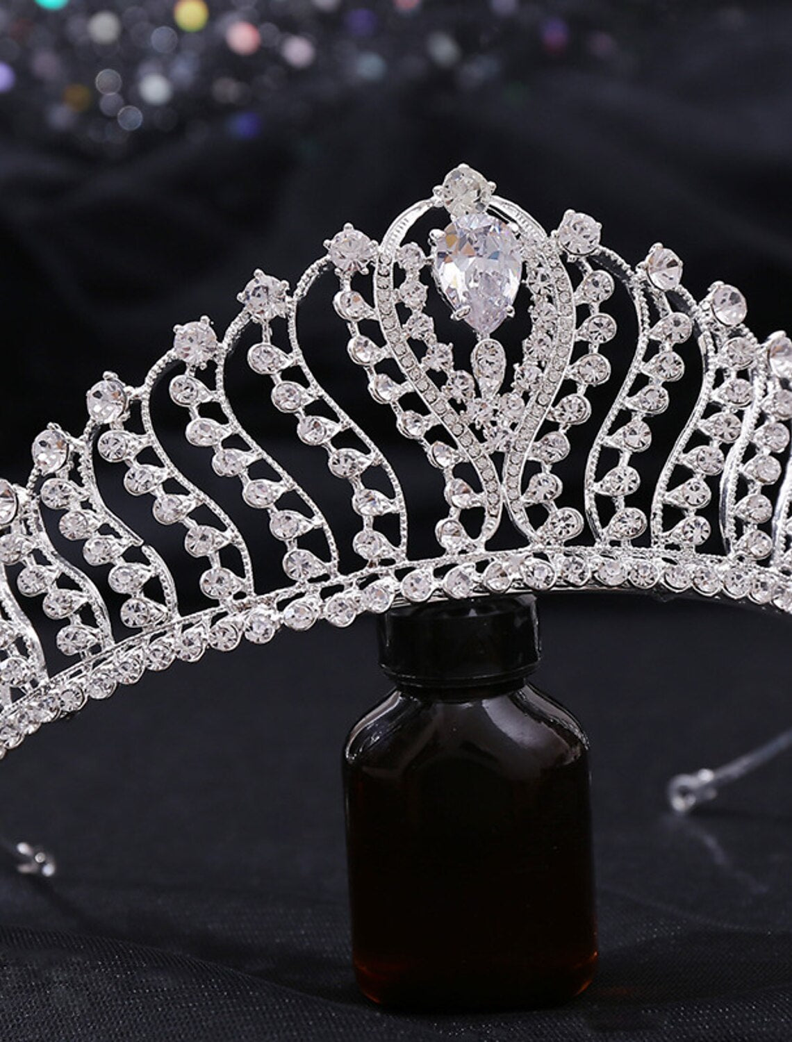 Side view of a glittery party headwear accessory.