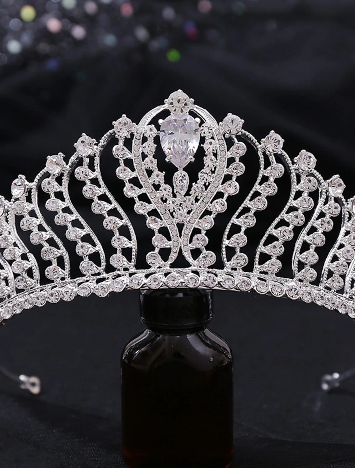 Front view of a shiny alloy tiara suitable for special occasions.