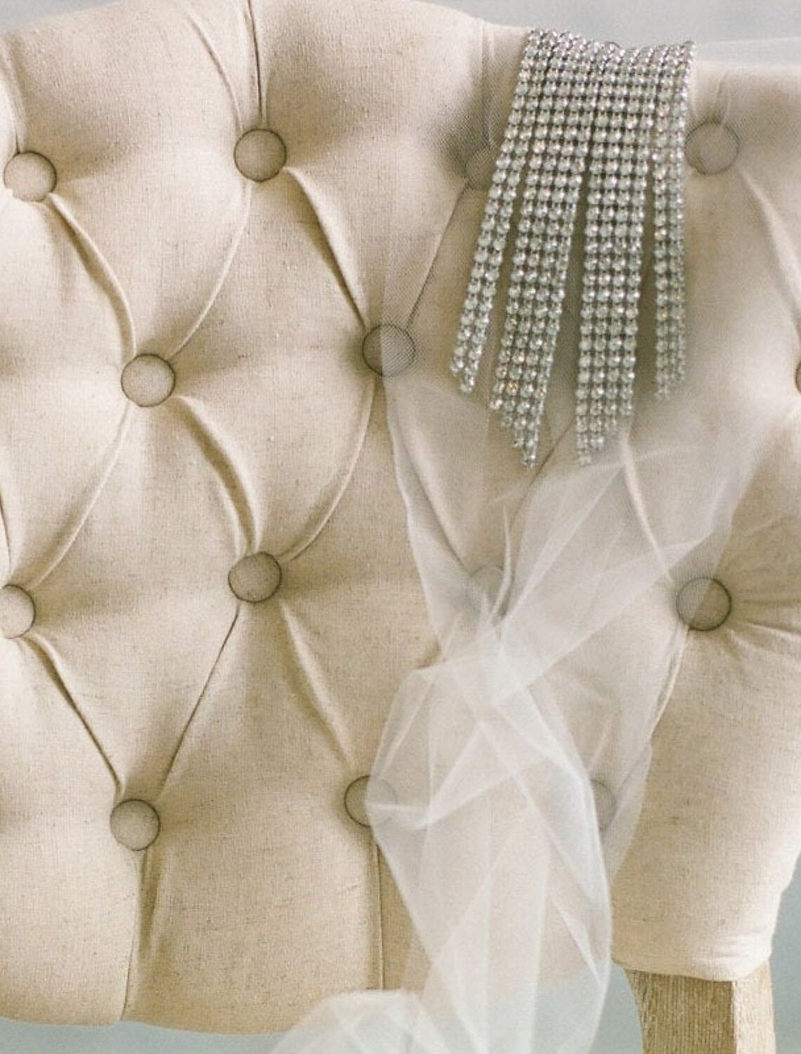 Elegant one-tier wedding veil with sparkling glitter tulle, styled as a blusher.