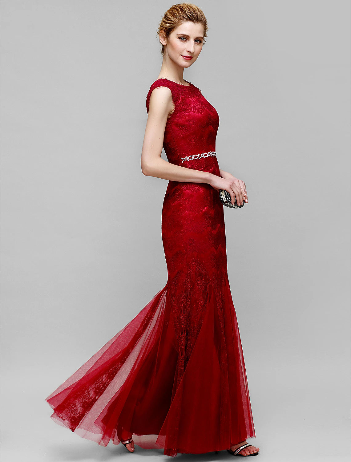 Close-up of sparkling lace and crystal embellishments on the dress.