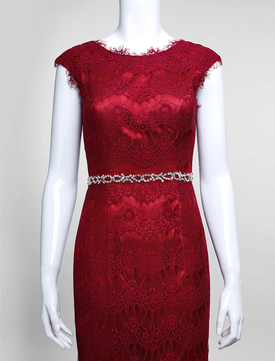 Textured view of the tulle skirt and lace bodice of the dress.