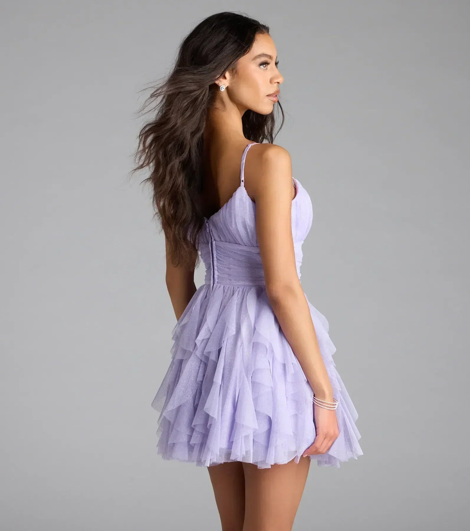 Model wearing a lavender glitter tulle mini dress for homecoming.