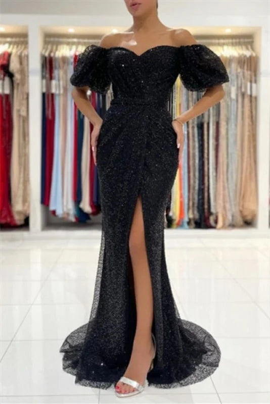Model wearing a sparkling long sleeve glitter ball gown.