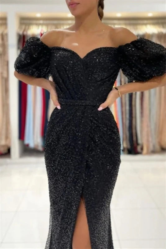 Back view of a sparkling long sleeve maxi dress.