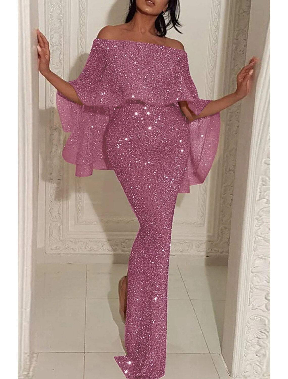 Close-up of the sequin details on the off-shoulder mermaid dress.