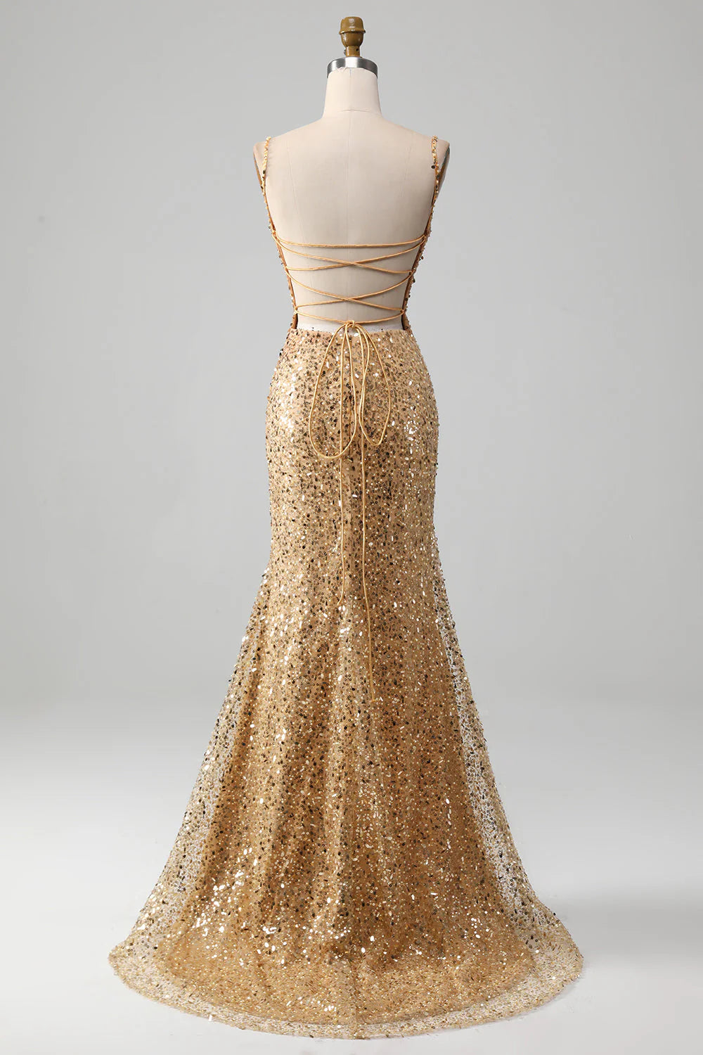 Back view of a golden sequined mermaid dress, highlighting the elegant silhouette.