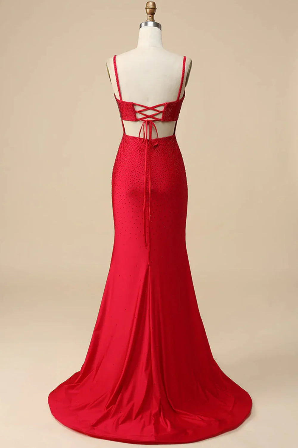 Back view of a red sequin mermaid dress with spaghetti straps.