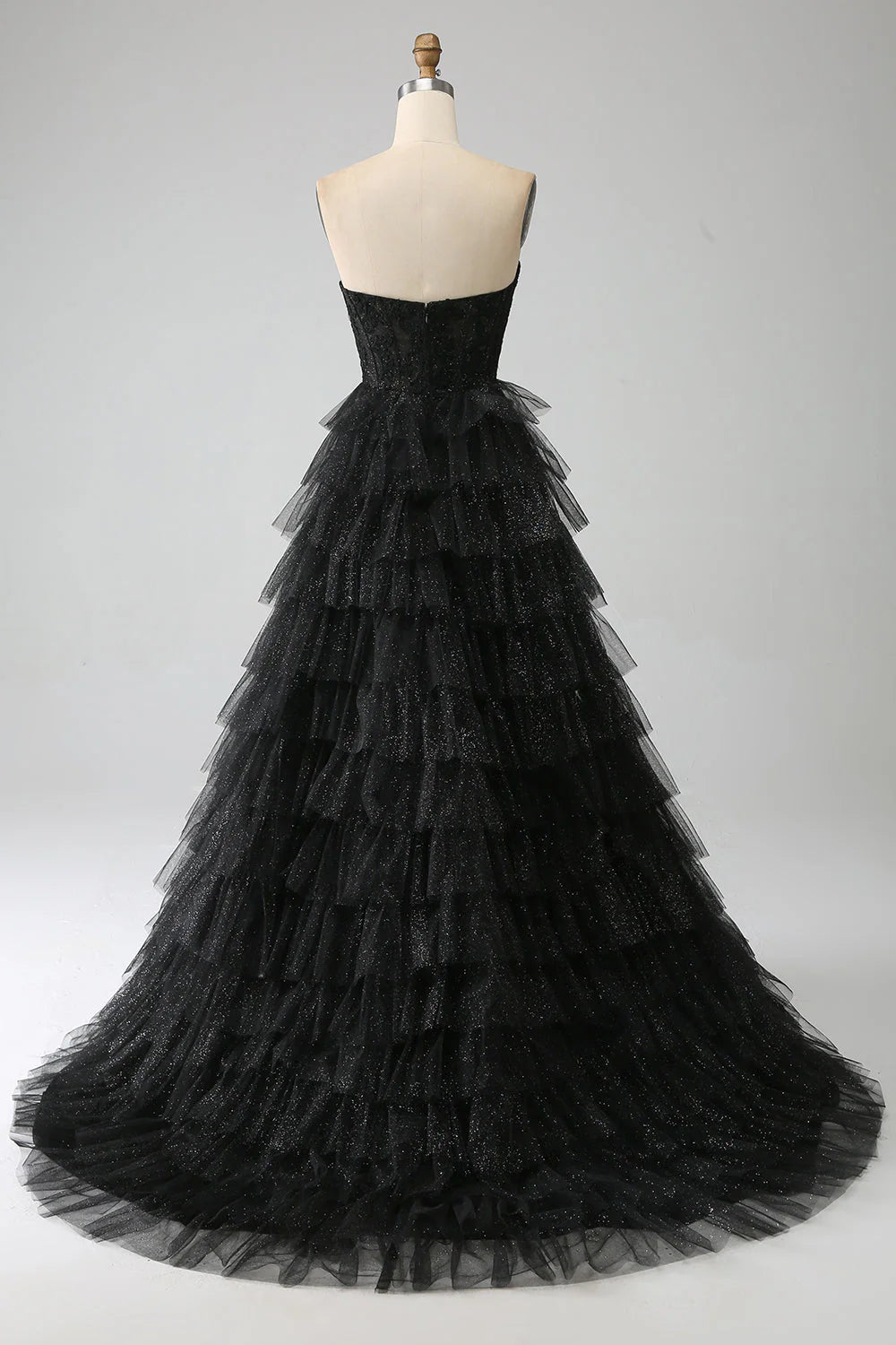 Back view of a black glitter prom dress, showcasing the corset detailing.