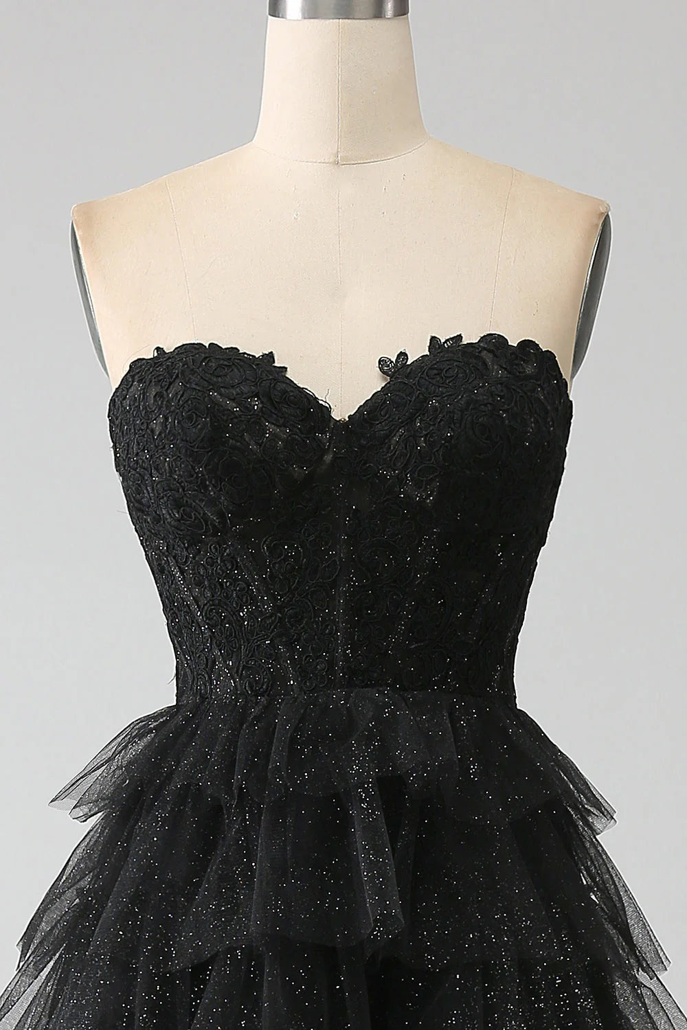 Full length view of the black glitter prom dress, highlighting the elegant slit.
