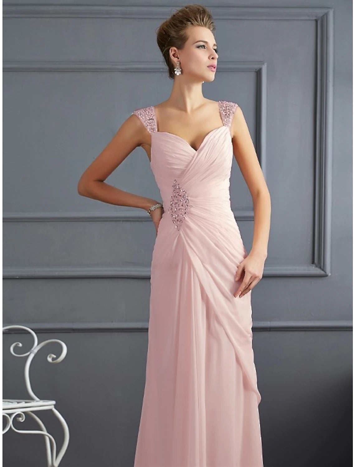 Side view of the woman in the sparkling mermaid trumpet dress, highlighting the ruched details.