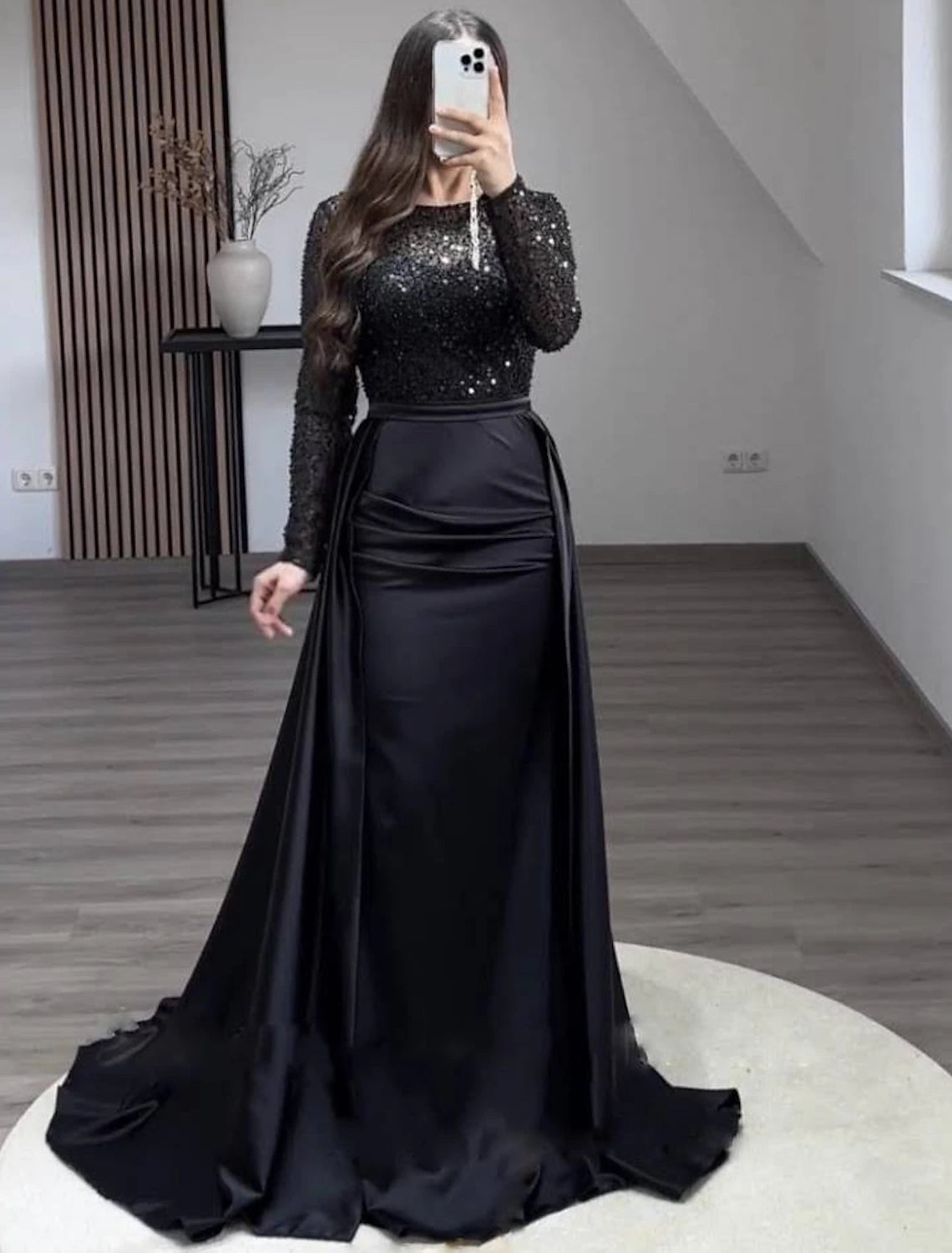 Back view of the elegant mermaid trumpet gown, highlighting the pearl-embellished overskirt.