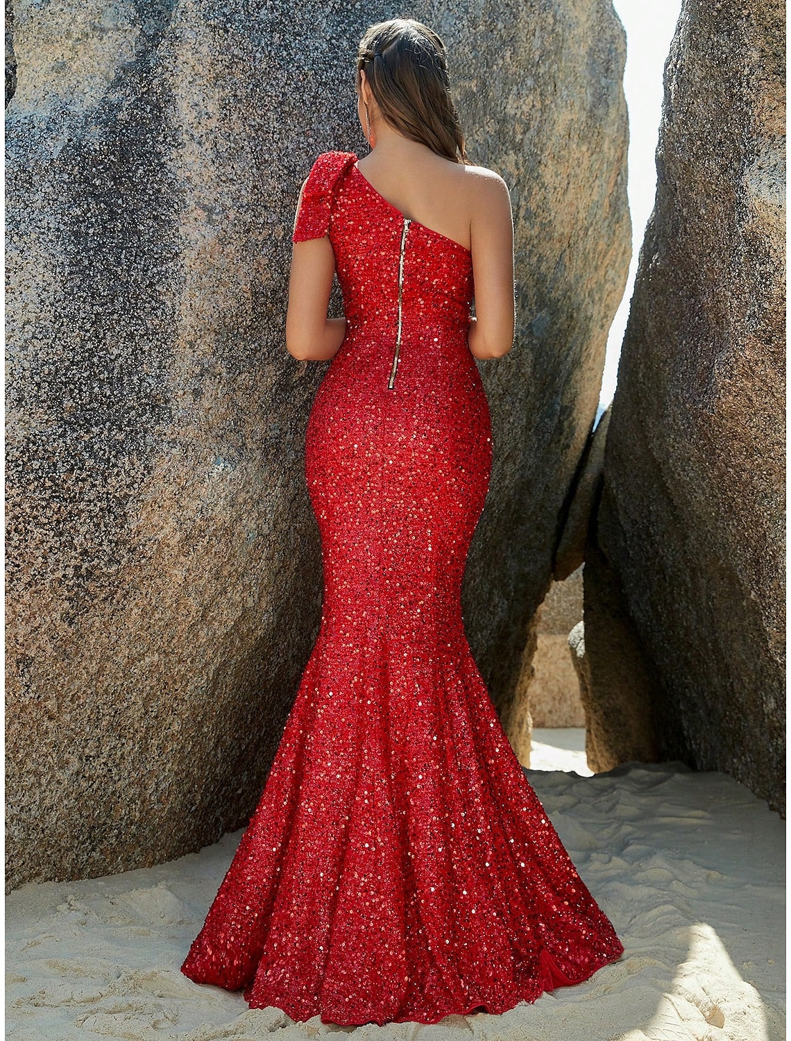 Full length view of a sequined mermaid trumpet gown, suitable for formal events.