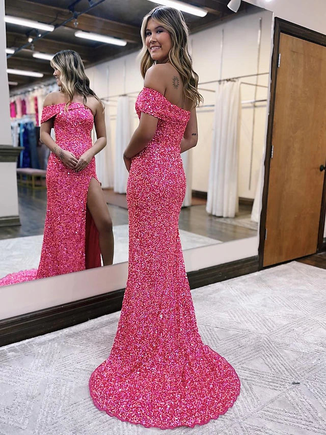 Close-up of the sequined fabric and one-shoulder detail on a mermaid prom dress.