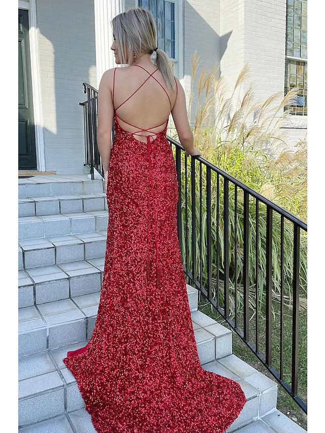 Side view of the sequined mermaid trumpet dress, highlighting the slit and train.