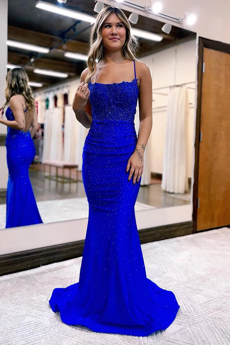Front view of a woman wearing a sequin-embellished prom dress.