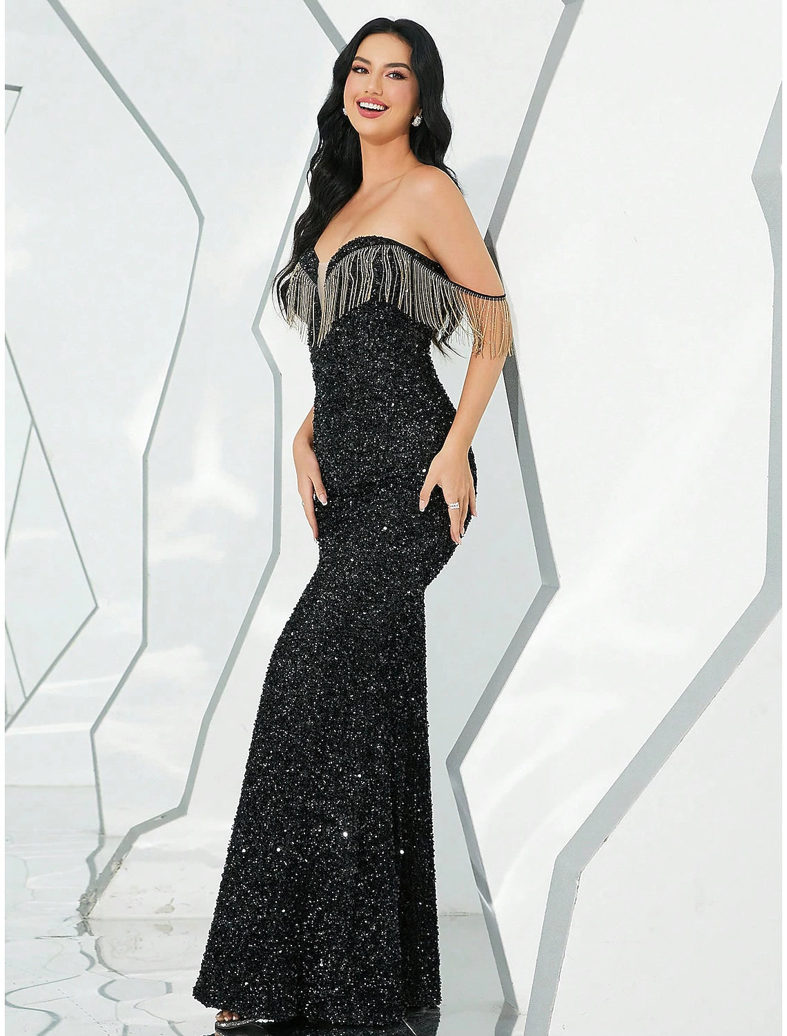 Side view of the floor-length mermaid trumpet gown, showcasing its elegant silhouette.