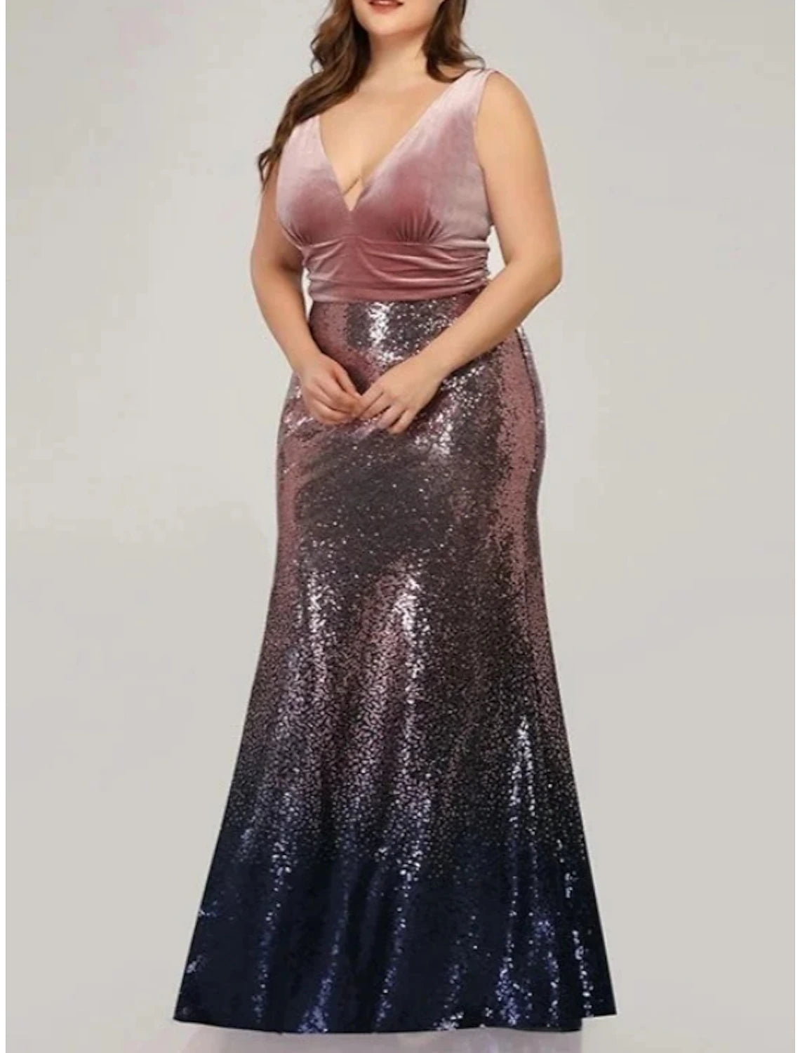 Side view of the elegant sequined trumpet gown.