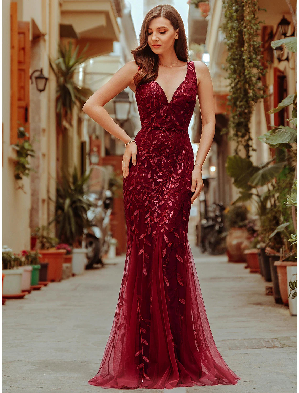 Elegant sparkling mermaid trumpet gown with V-neck.