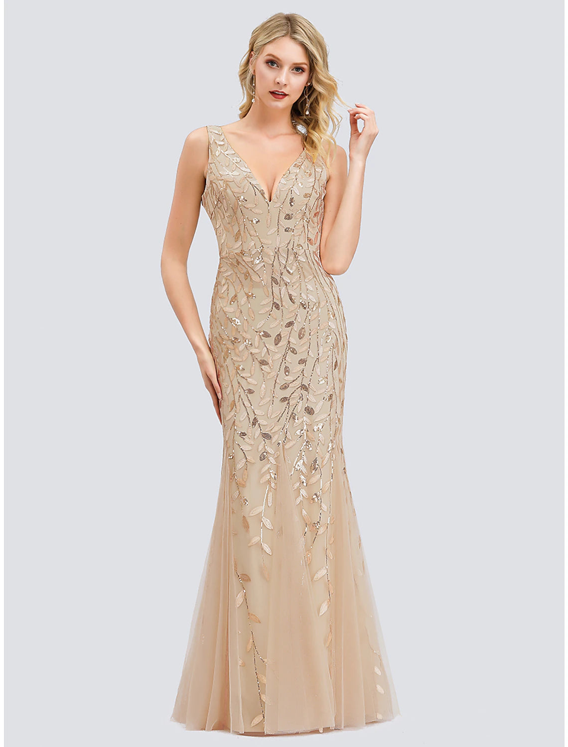 Model showcasing a sleeveless V-neck sparkling prom dress.