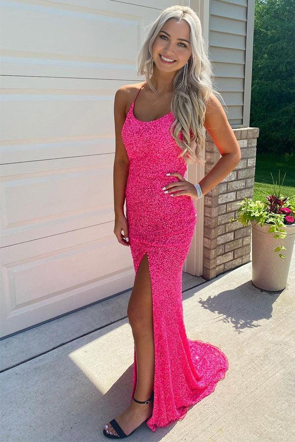 Hot pink mermaid prom dress with glitter and a high slit.