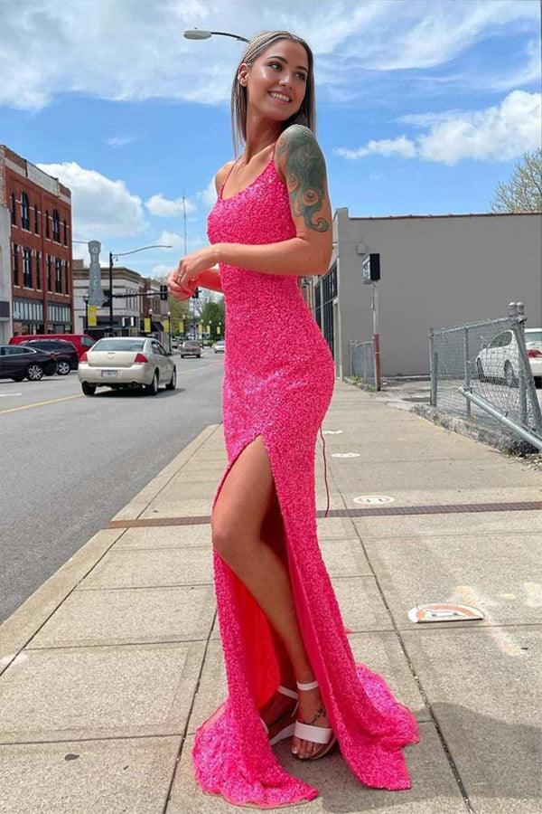 Side view of a hot pink mermaid dress with sparkling fabric.