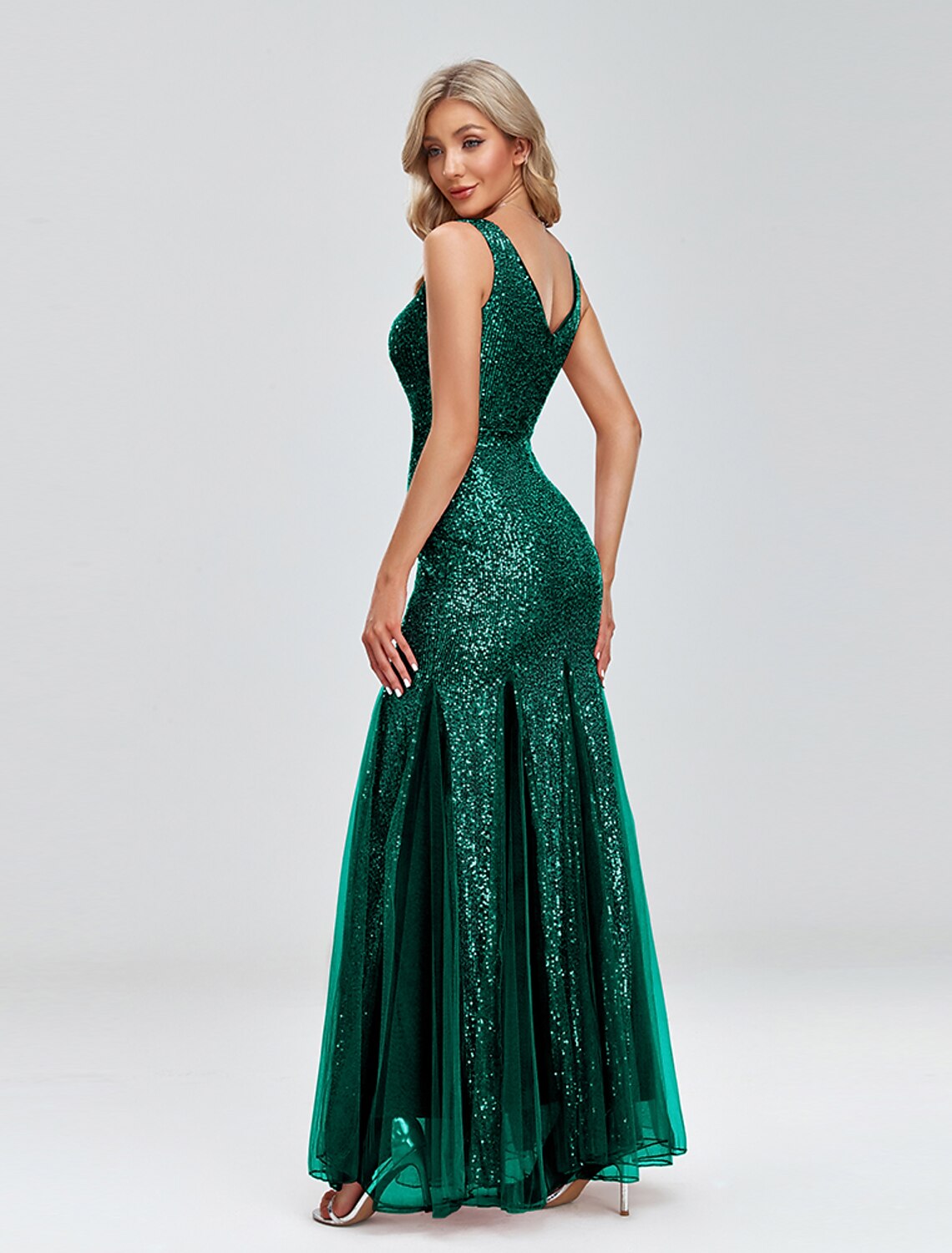 Side view of the mermaid evening gown, highlighting the floor-length silhouette.