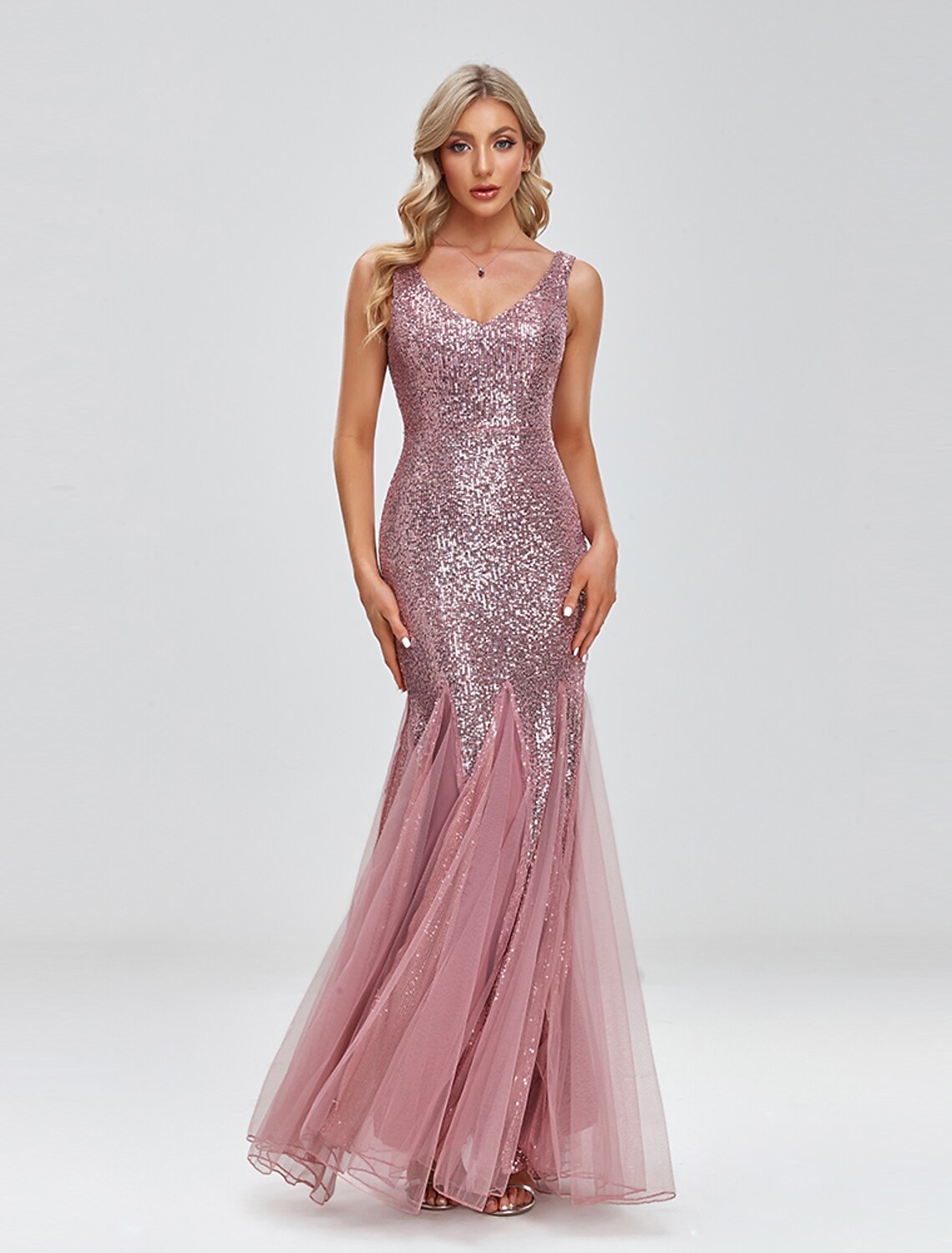 Close-up of the V-neckline and sequin splicing on the tulle fabric.