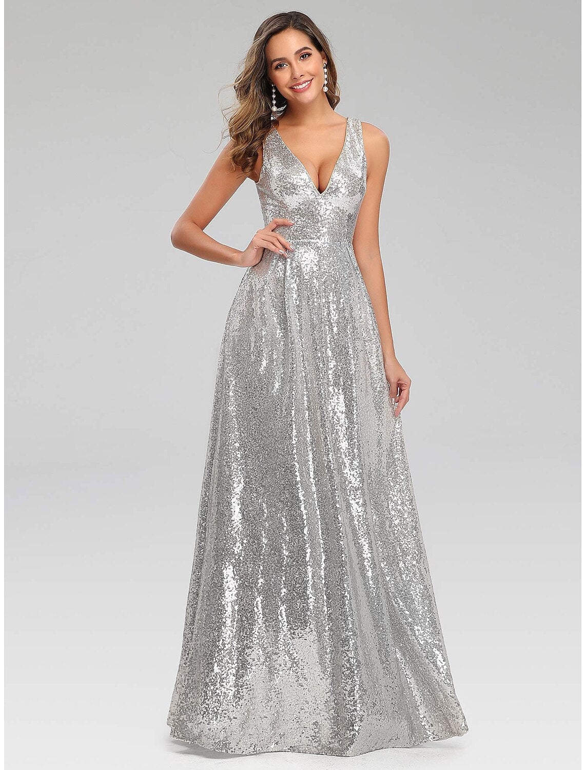 Woman in a sparkling navy A-line sequin prom gown.
