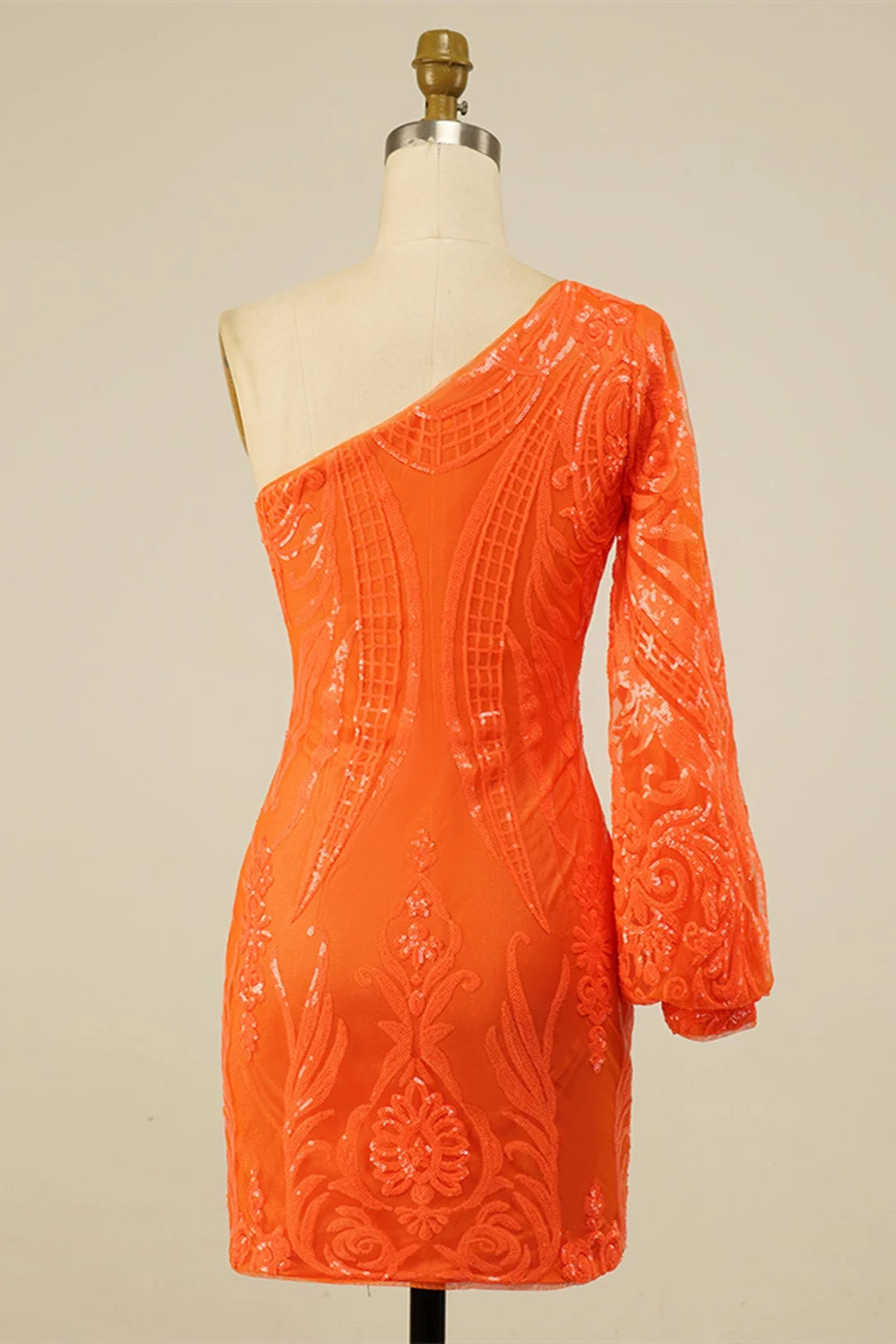 Elegant one-shoulder long sleeve dress with sequin and embroidery details.